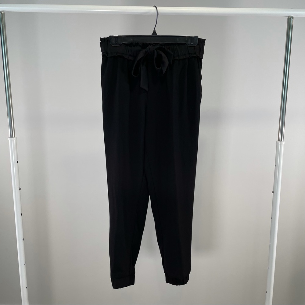 Formal black jogger style pants with an elastic waist